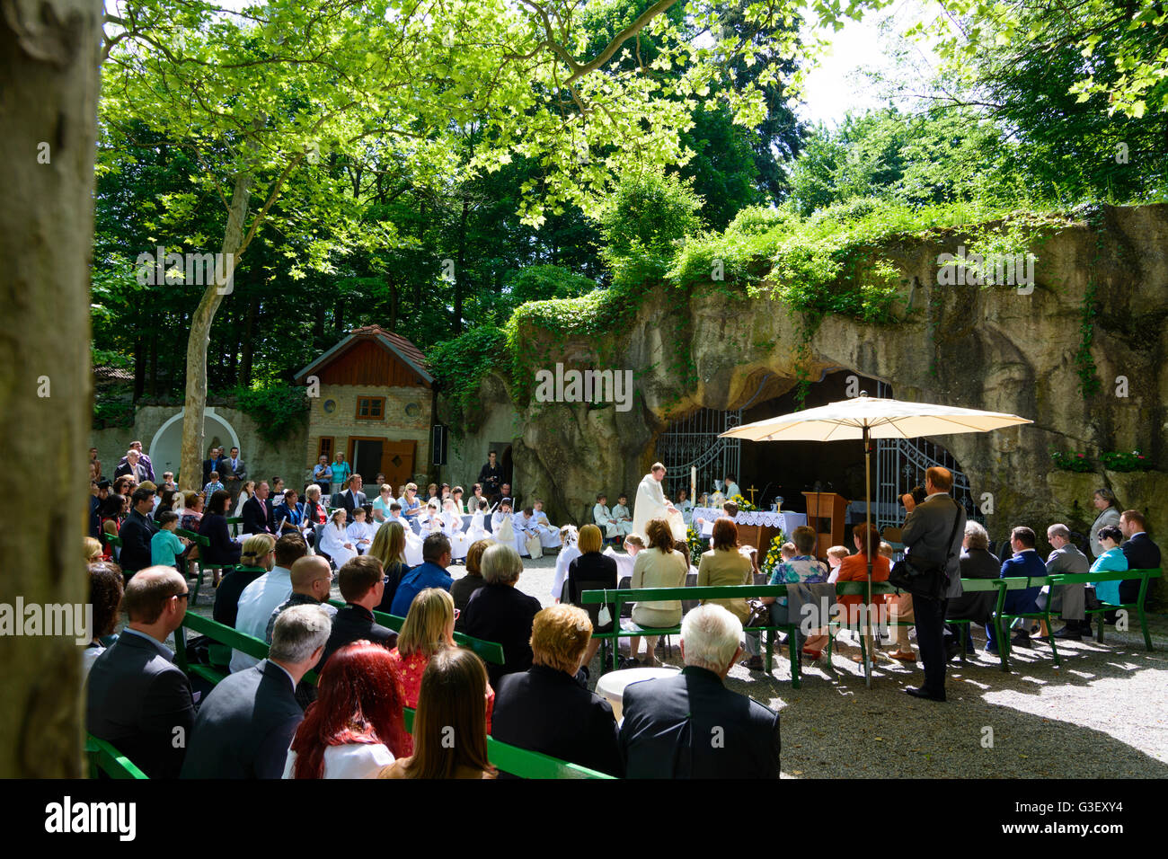 Lourdes Grotto in Maria Ellend at a first communion, Austria, Niederösterreich, Lower Austria, Donau, Haslau-Maria Ellend Stock Photo