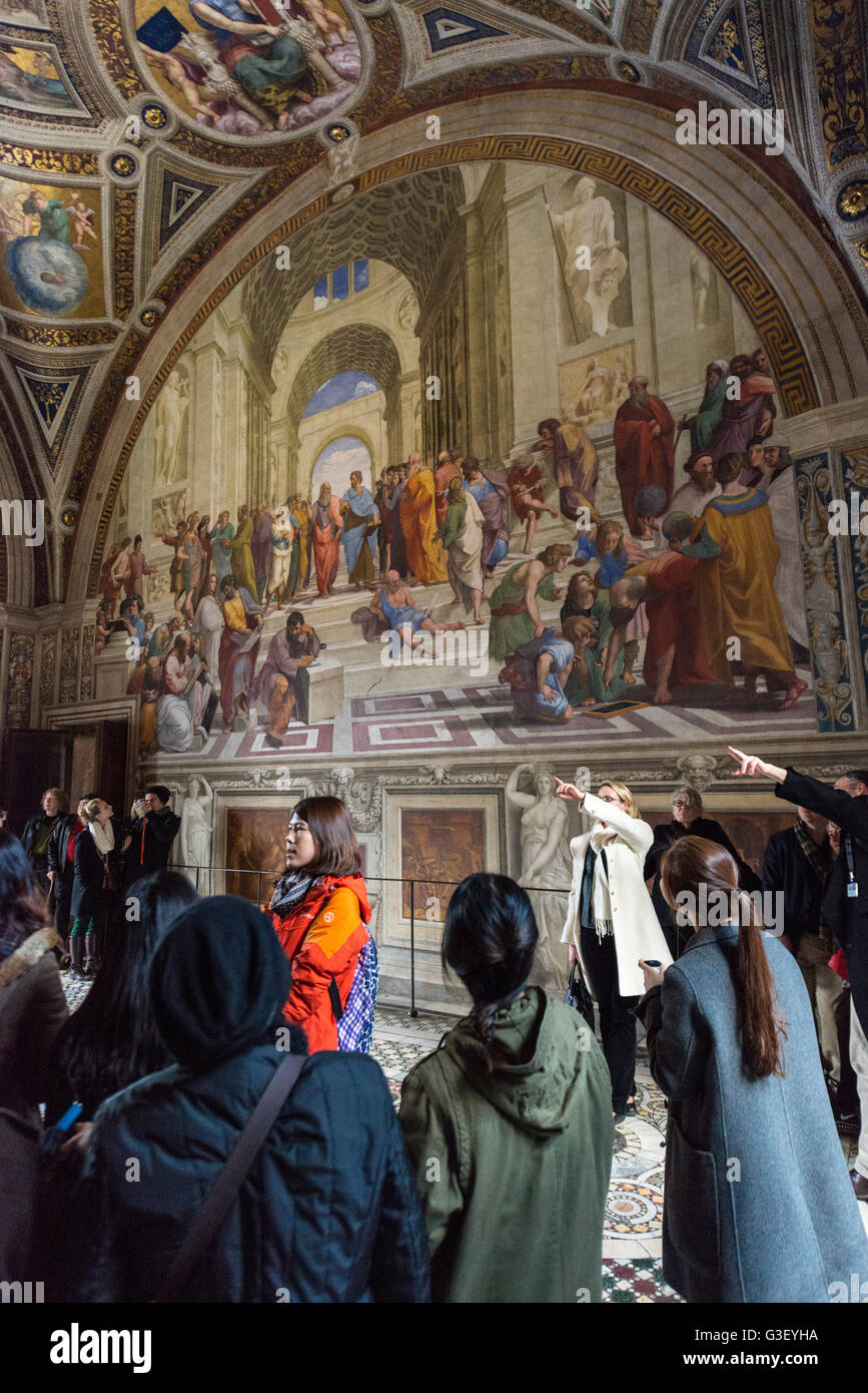 Rome. Italy. Visitors admire the Raphael Rooms, Stanza della Segnatura, Vatican Museums.  Musei Vaticani. Stock Photo