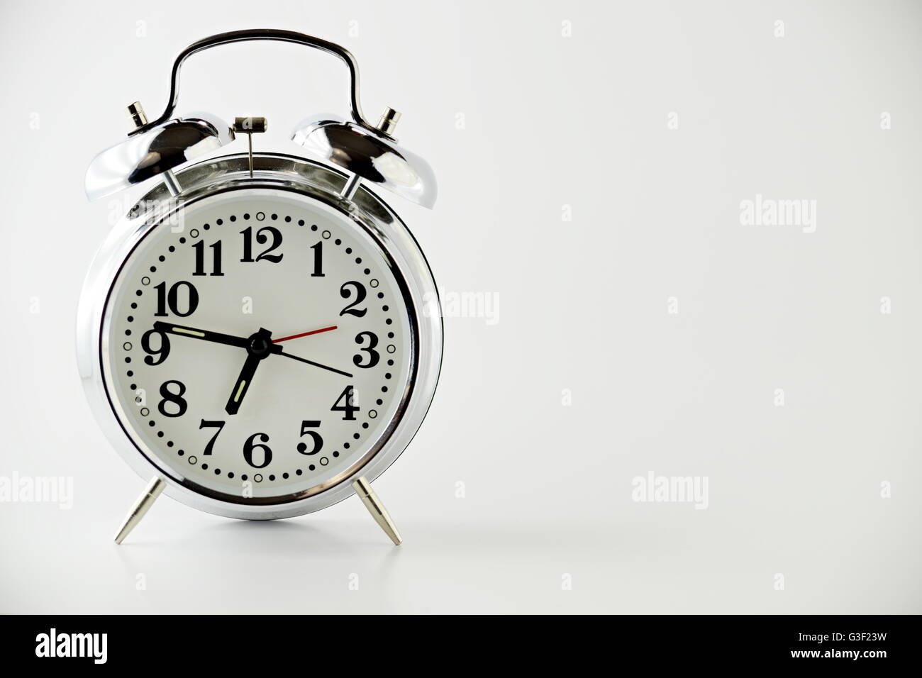 Alarm Clock on white background Stock Photo - Alamy