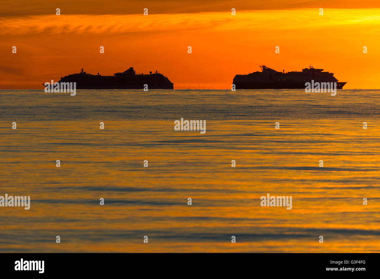 Sunset over Sea with Two Cruise Ship in Summer, Sealand Odde, Odsherred, Baltic Sea, Sealand, Denmark Stock Photo