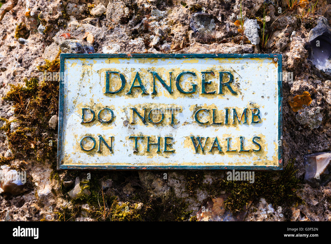 Danger sign on the walls of the Roman Fort at Burgh Castle, Norfolk, England. Stock Photo