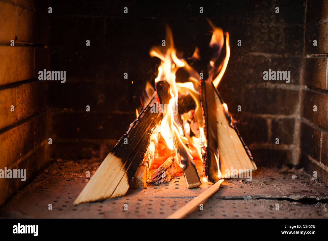 Fire burning brick fireplace (outdoor terrace Stock Photo Alamy