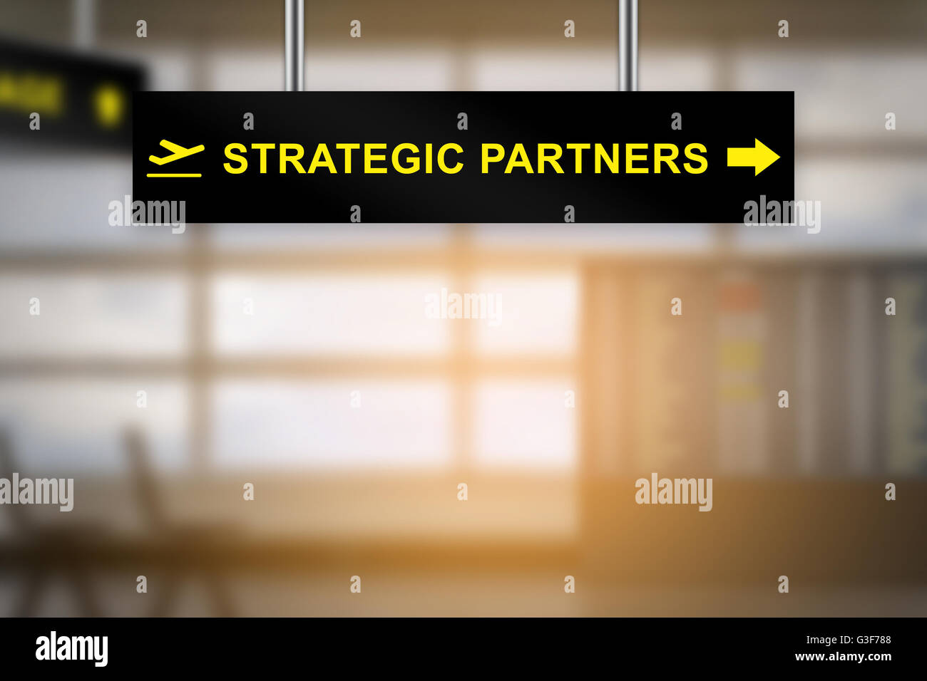 strategic partners on airport sign board with blurred background and copy space Stock Photo