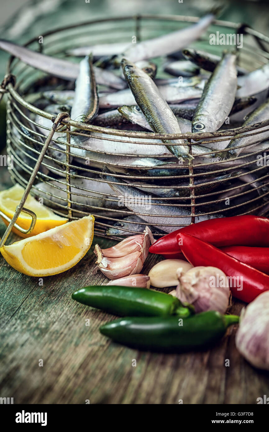 raw sardines with garlic, lemon and Jalapeño peppers Stock Photo Alamy