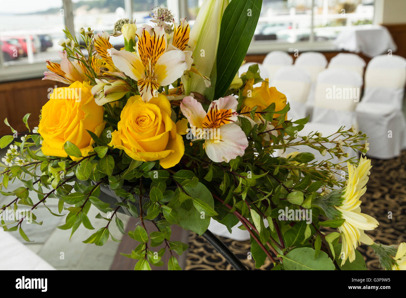 Close up of flowers on desk at wedding venue Stock Photo Alamy