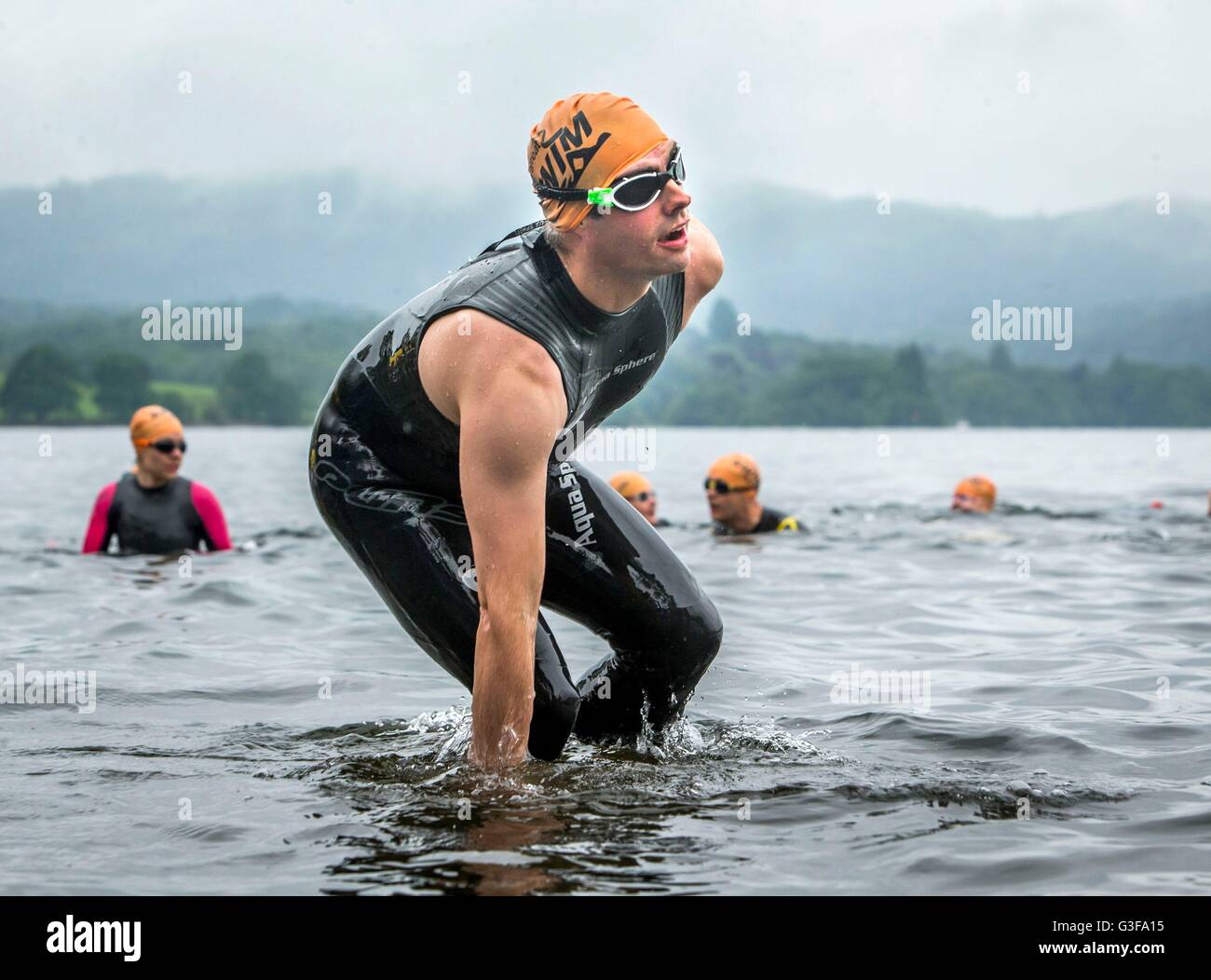 Swimmers take part in the Great North Swim on Lake Windermere in Cumbria. Stock Photo