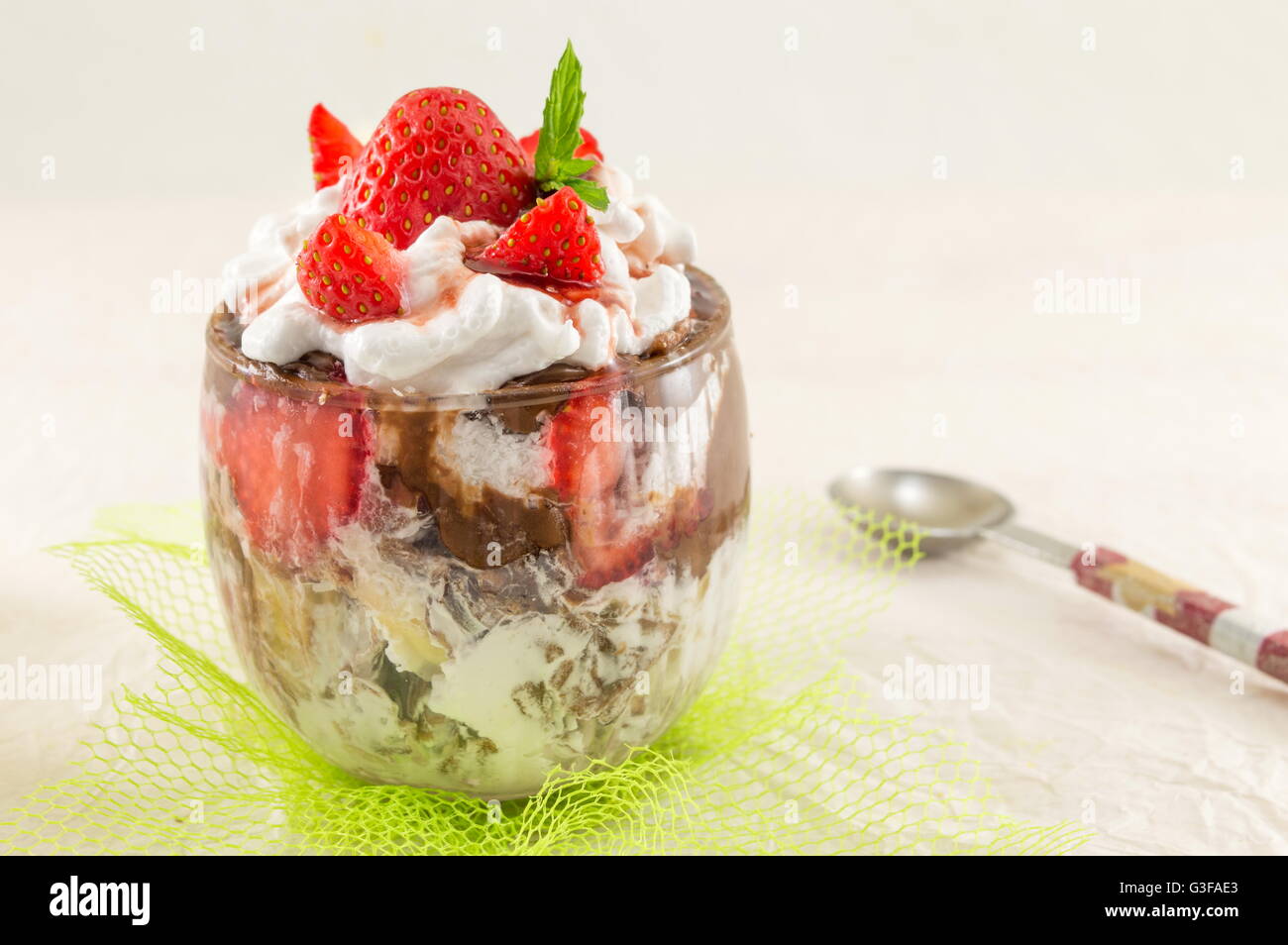 Strawberry parfait in a glass and fresh strawberries Stock Photo