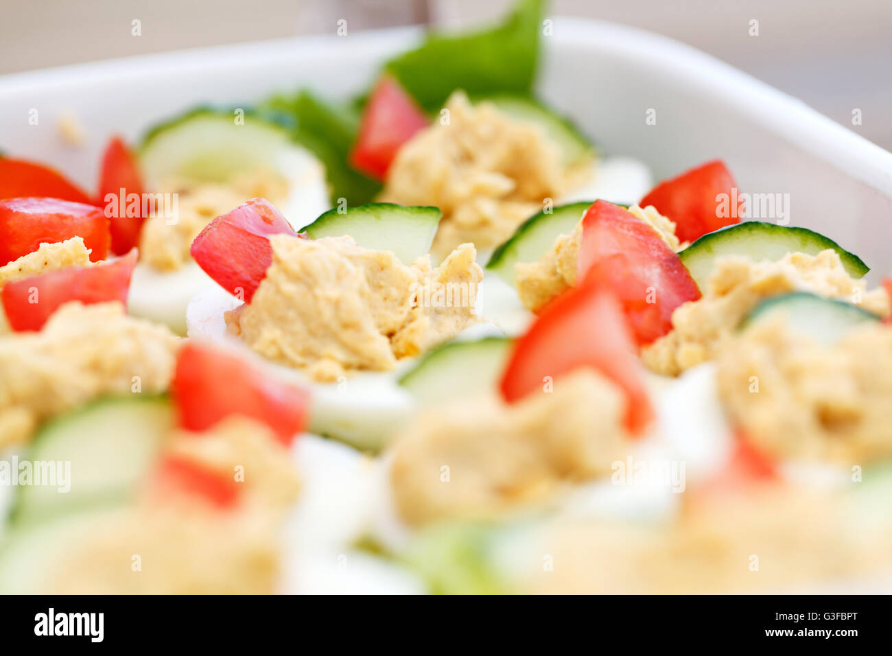 Delicious Devilled Eggs served on a bed of lettuce ready for a Barbecue, Buffet or afternoon tea Stock Photo