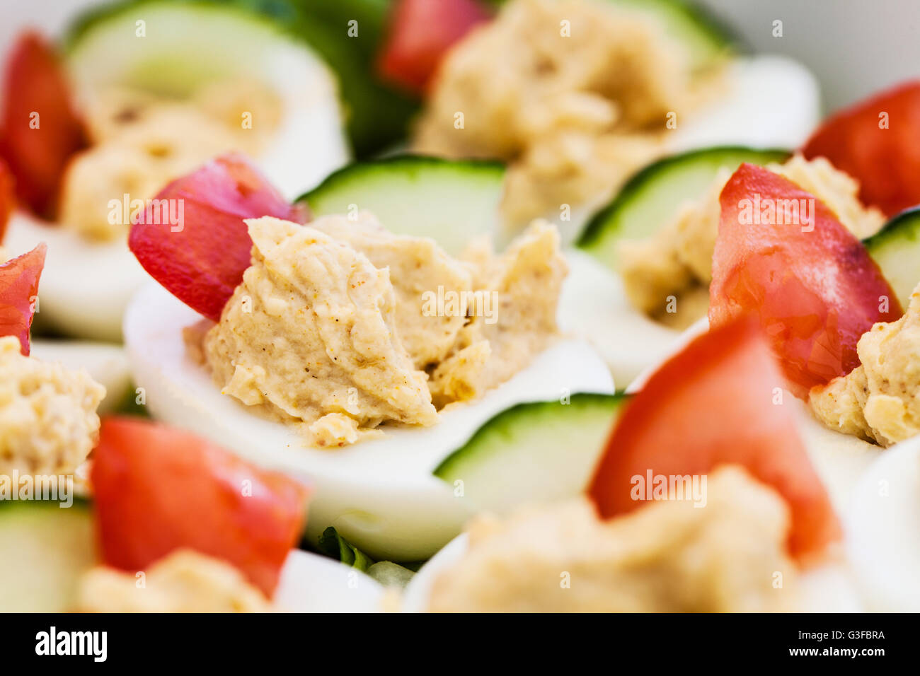 Delicious Devilled Eggs served on a bed of lettuce ready for a Barbecue, Buffet or afternoon tea Stock Photo