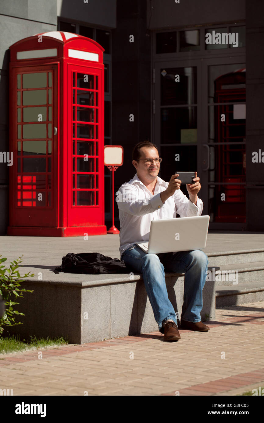 Man Using Red Telephone Person using red telephone box hi-res stock photography and images - Alamy