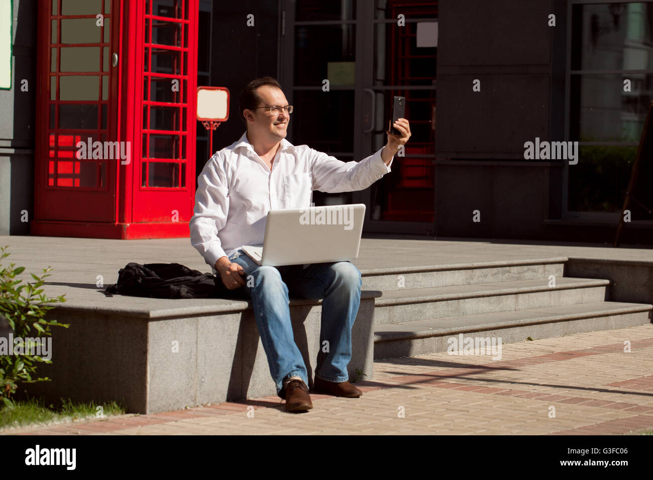 Man Using Red Telephone Person using red telephone box hi-res stock photography and images - Alamy