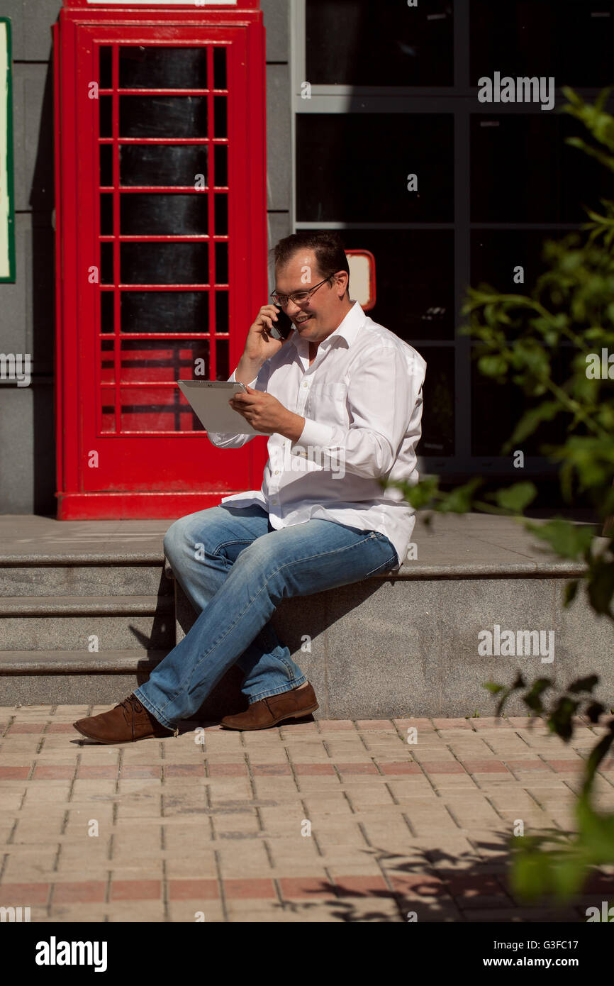 Man Using Red Telephone Person using red telephone box hi-res stock photography and images - Alamy