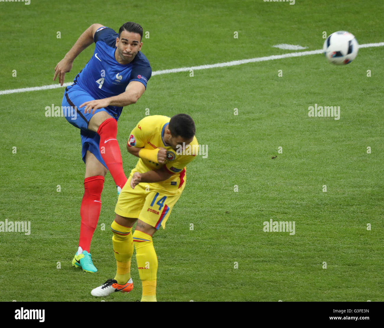 Paris, France. 10th June, 2016. Adil Rami (L) of France competes during the Euro 2016 Group A soccer match between France and Romania in Paris, France, June 10, 2016. Credit:  Bai Xuefei/Xinhua/Alamy Live News Stock Photo