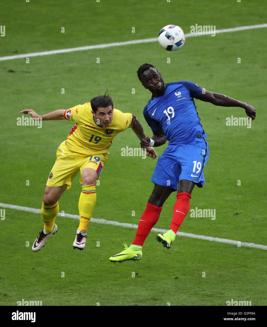 Paris, France. 10th June, 2016. Bacary Sagna (R) of France vies with Bogdan Stancu of Romania during the Euro 2016 Group A soccer match between France and Romania in Paris, France, June 10, 2016. Credit:  Bai Xuefei/Xinhua/Alamy Live News Stock Photo