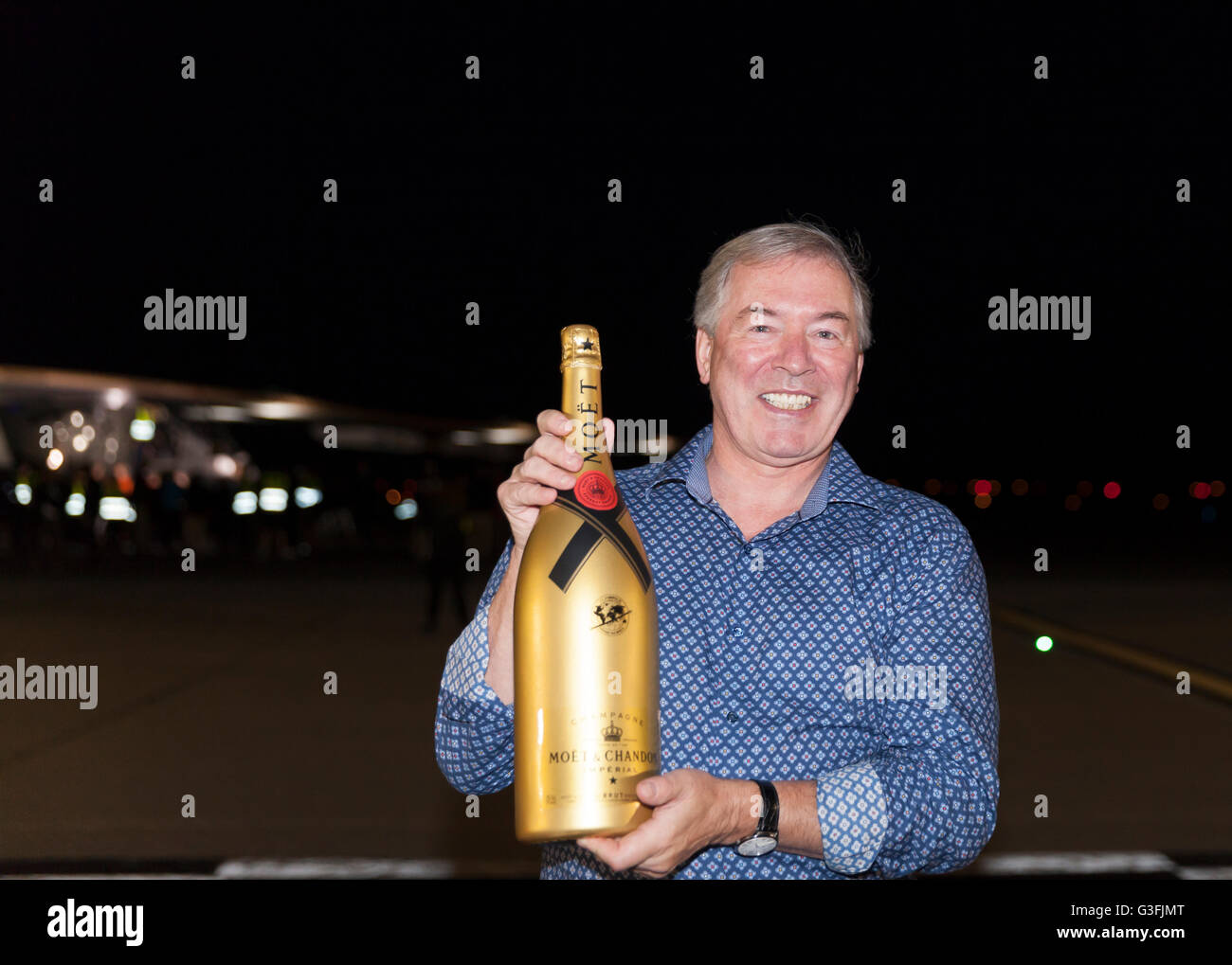 Jim Clerkin, CEO of Moet Hennessy, poses near the sun-powers Solar