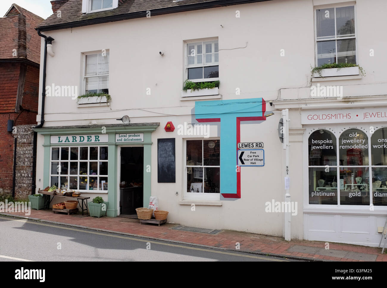Ditchling, Sussex, UK. 11th June, 2016. Four properties in the small village of Ditchling in Sussex have been painted with the letters T,Y,P and E to celebrate 100 years of a typeface created by Edward Johnston for the London Underground . The Village of Type has been created by the local Ditchling Museum and the letters will remain for a month this summer  Credit:  Simon Dack/Alamy Live News Stock Photo