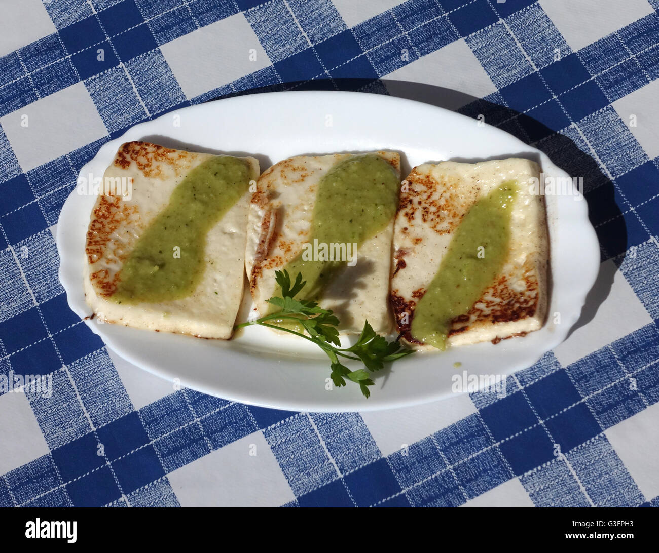 A picture dated 20 May 2016 shows fried goat cheese with Mojo verde, a Spanish sauce with herbs, garlic, vinegar and oil - a typical Palmeric dish - on the Canary island of La Palma, Spain. Photo: Jens Kalaene - NO WIRE SERVICE - Stock Photo
