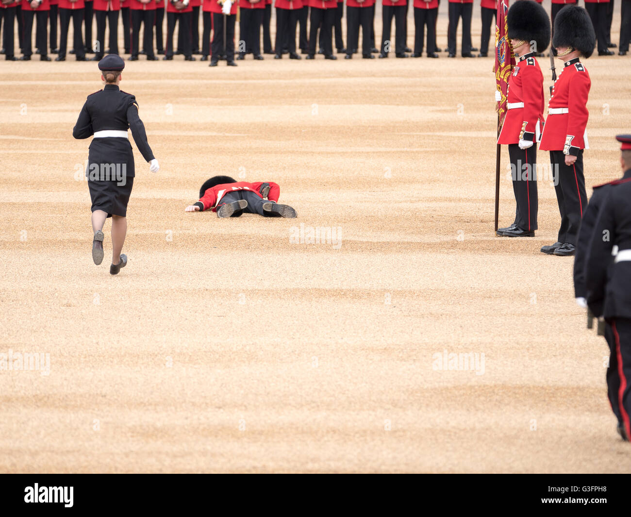 London, UK. 11th June, 2016.  One of the escorts to the Color faints at the start of the parade Credit:  Ian Davidson/Alamy Live News Stock Photo