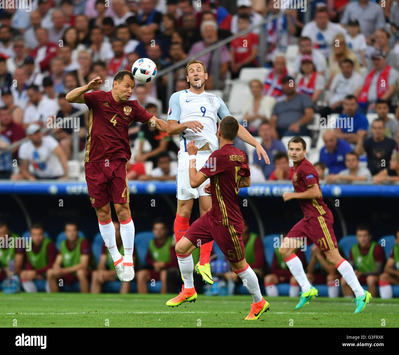 Marseille, France. 11th June, 2016. Harry Kane (2nd L) of England vies with Sergei Ignashevich (1st L) of Russia during the Euro 2016 Group B soccer match between Russia and England in Marseille, France, June 11, 2016. © Tao Xiyi/Xinhua/Alamy Live News Stock Photo
