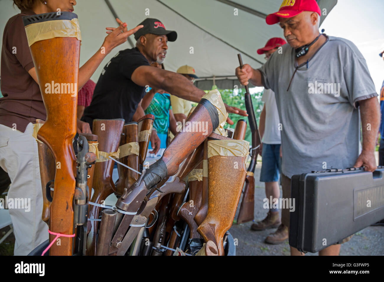 Detroit, Michigan USA - 11th June 2016 - People turn in old guns as the Wayne County sheriff offers $50 with no questions asked for each weapon surrendered. Credit:  Jim West/Alamy Live News Stock Photo