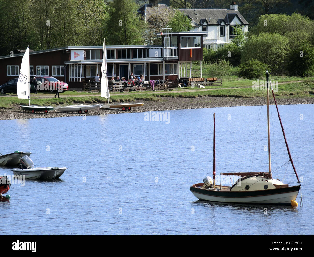Boats Moored on St Marys Loch with Boat Clubhouse & Tibbie Shiels Inn, Upper Yarrow Valley, Borders Scotland, UK Stock Photo
