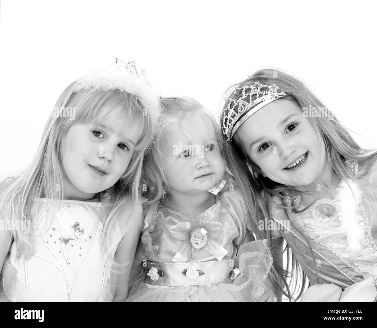 Children dressed up, wearing disney princess dresses, siblings concept ...