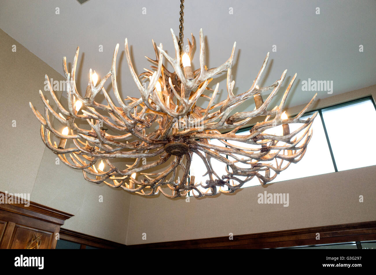 Light shade made from animal antlers hanging in a local motel. Redwood Falls Minnesota MN USA Stock Photo