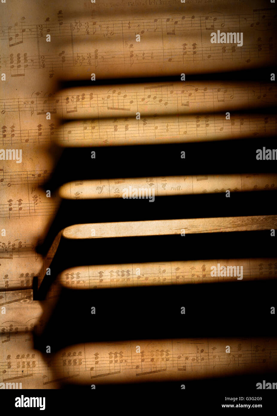Piano keys close up with sheet music Stock Photo - Alamy