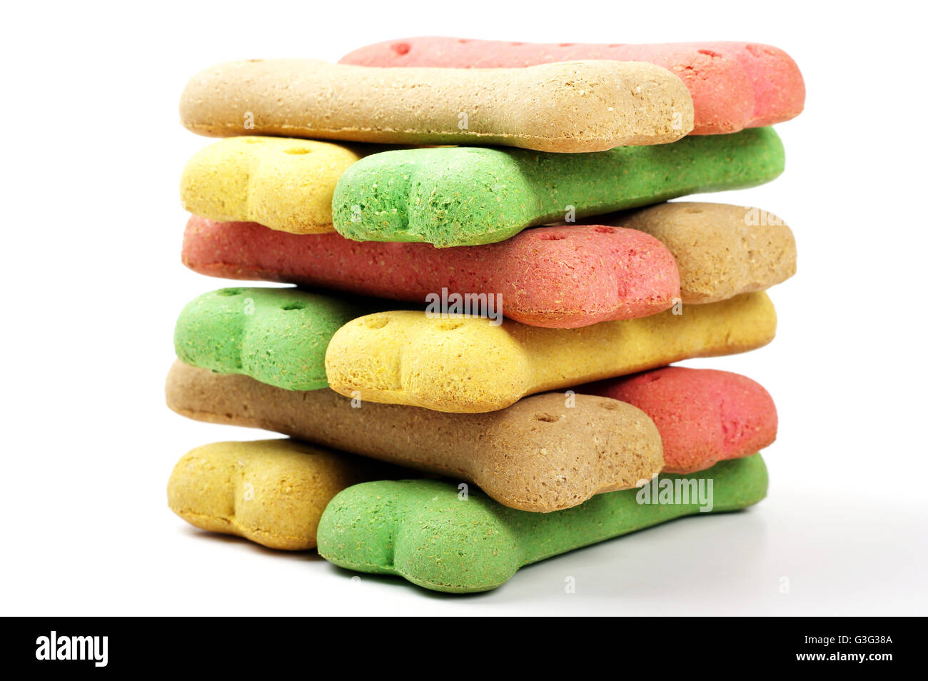 stacked colored dog biscuit bones on a white background Stock Photo