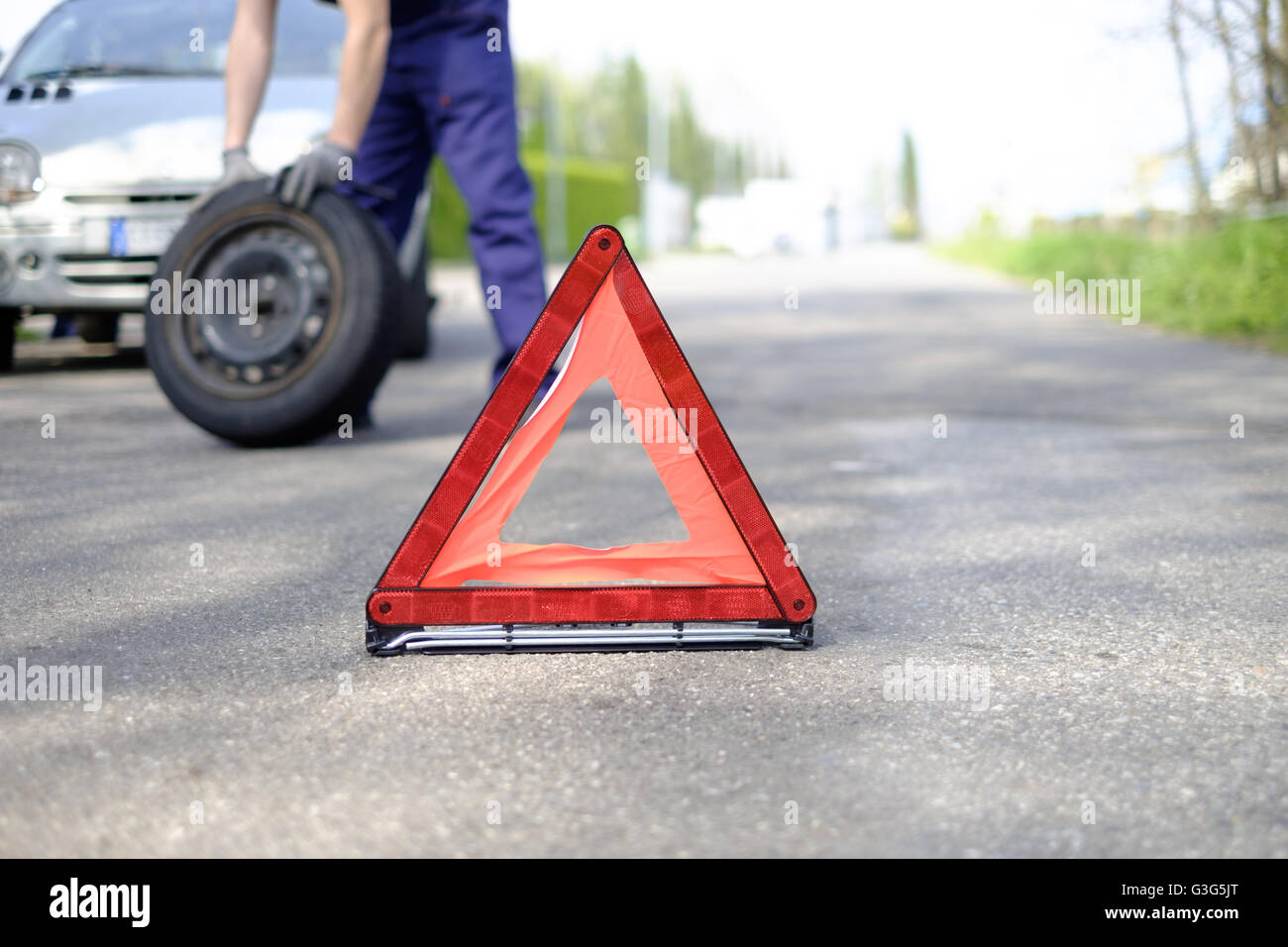 man fixing a car problem after vehicle breakdown on the road Stock ...
