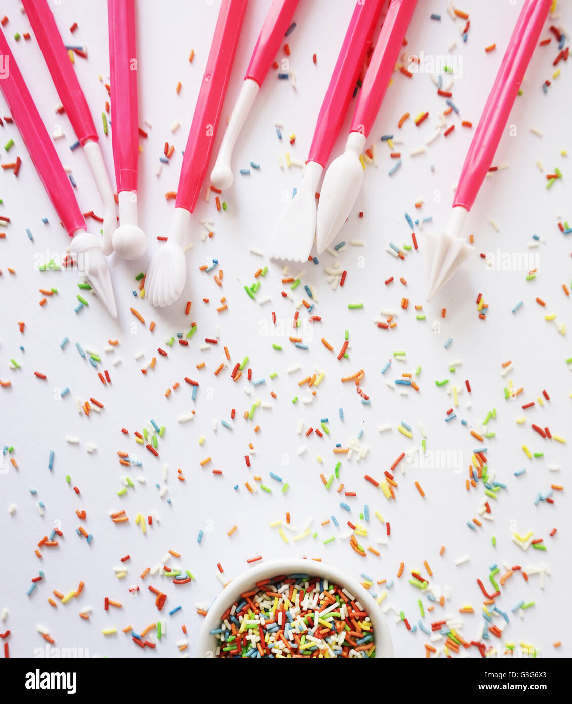 Colorful sprinkles and cake's decoration tools Stock Photo
