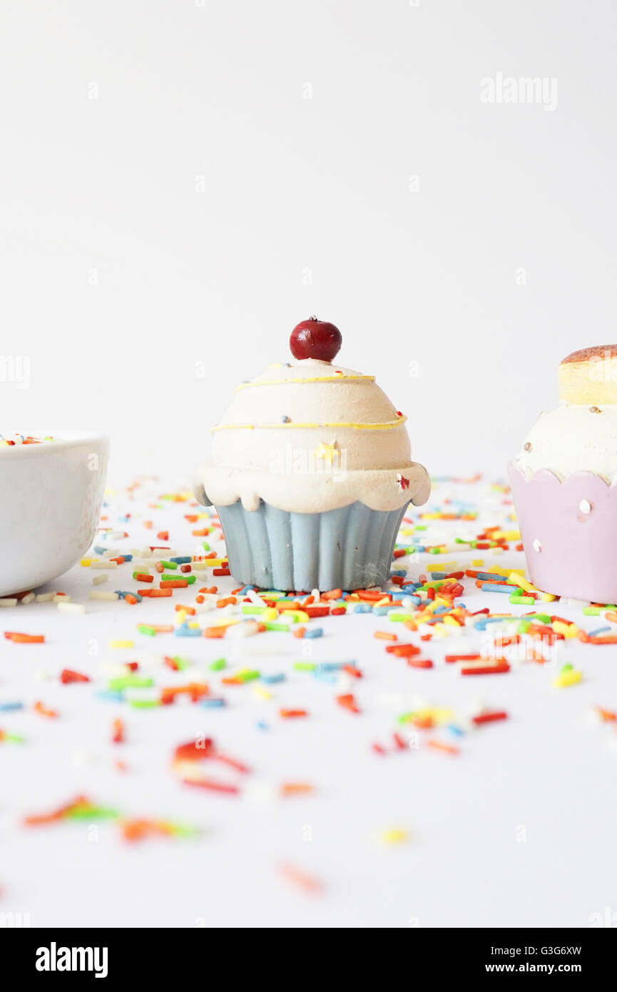 Decorative cupcake and colorful sprinkles Stock Photo