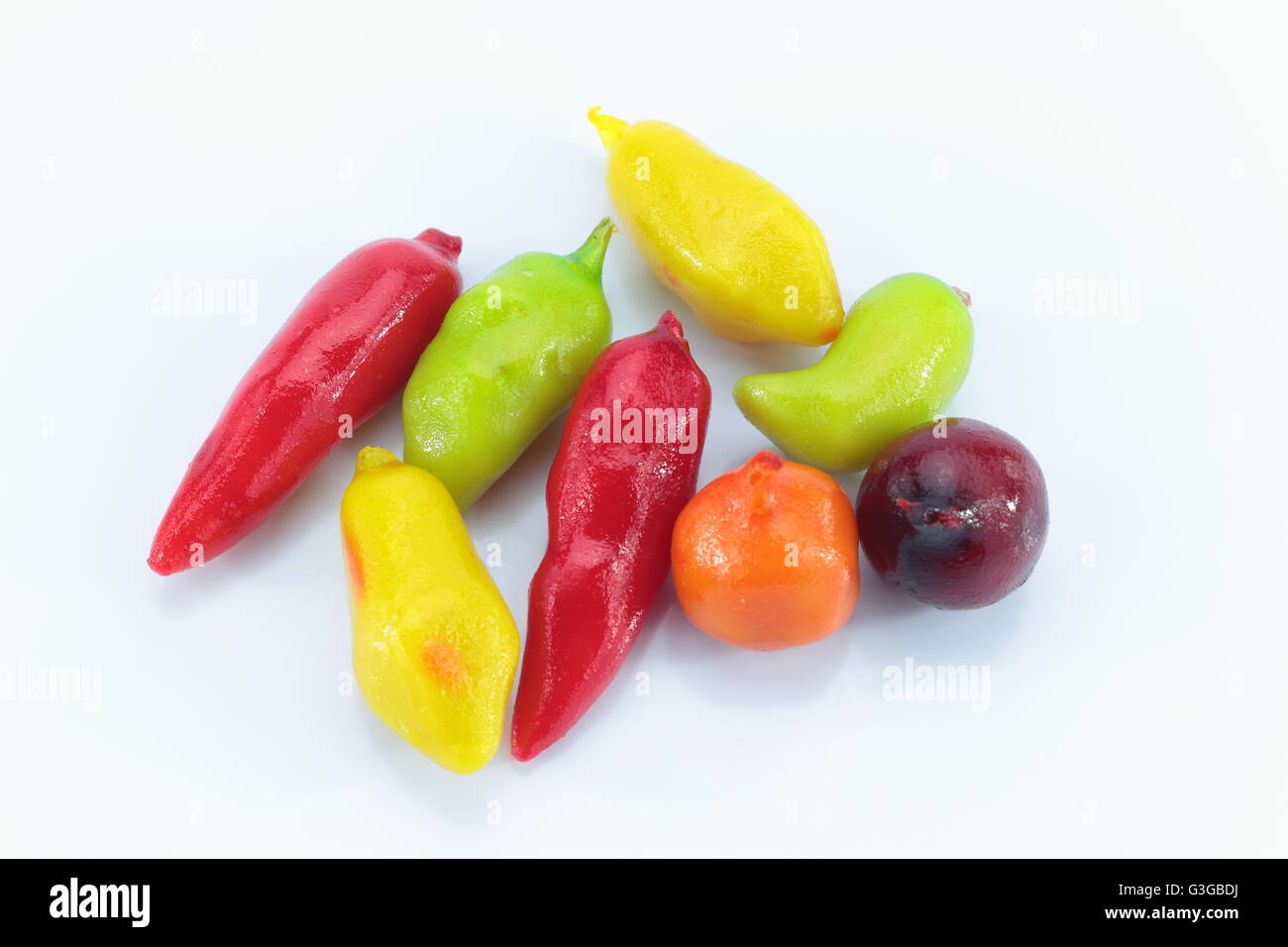 deletable imitation fruits on white background Stock Photo - Alamy