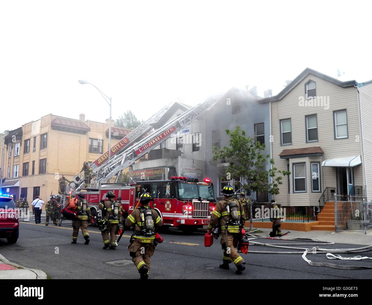 Alarm fire breaks out at 410 West Side Ave in Jersey City, NJ. With at  least one person taken away by ambulance but some reports say as many as  three people were