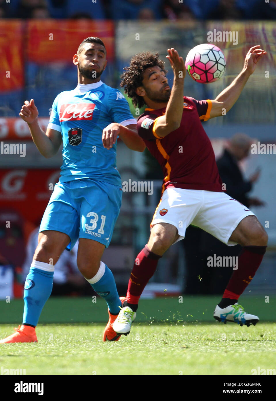 Rome, Italy. 25th Apr, 2016. Roma's forward from Egypt Mohamed Salah (R) fights for the ball with Napoli's Algerian defender Faouzi Ghoulam during the Serie A football match AS Roma vs SSC Napoli at the Olimpico Stadium. Roma won for 1-0 result. © Carlo Hermann/Pacific Press/Alamy Live News Stock Photo