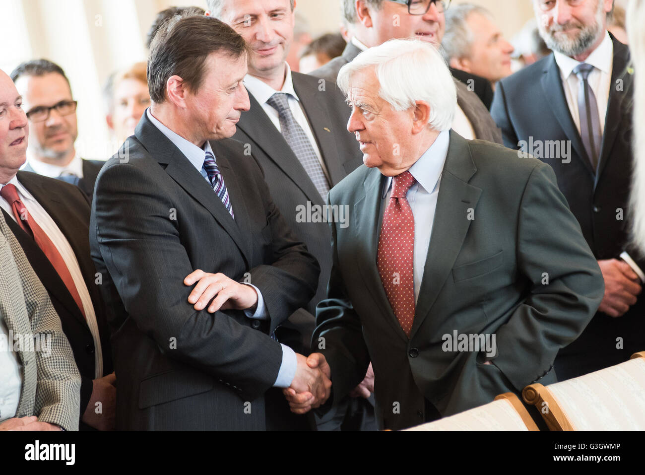 Ljubljana, Slovenia. 24th May, 2016. Peter Prevc's father (left) and former president of Slovenia Milan Kucan (right) at the ceremony where Peter Prevc received Golden Order of Merit that from President of the Republic of Slovenia Borut Pahor in Ljubljana, Slovenia on May 24, 2016. © Rok Rakun/Pacific Press/Alamy Live News Stock Photo