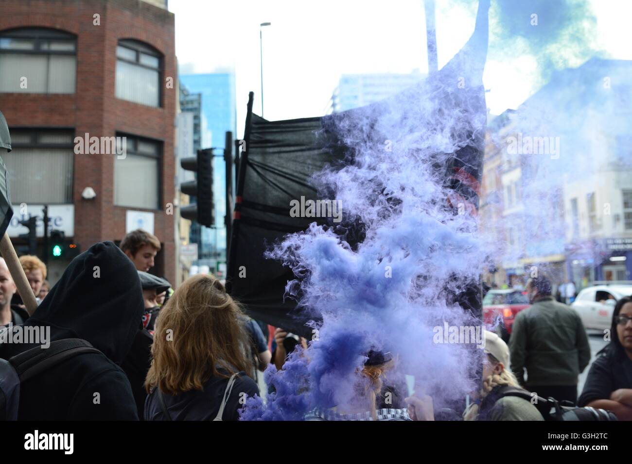 London, UK. 24 June, 2016. Pro-europe and migrant rally held in London.  Smoke rises from a smoke grenade, one of many to be let off during the march. Credit:  Marc Ward/Alamy Live News Stock Photo