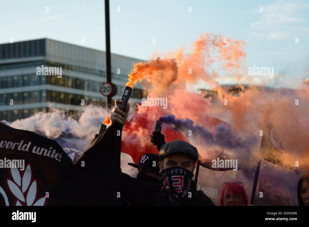 London, UK. 24 June, 2016. Pro-europe and migrant rally held in London.  More smoke filling the air during pro-refugee march. Credit:  Marc Ward/Alamy Live News Stock Photo