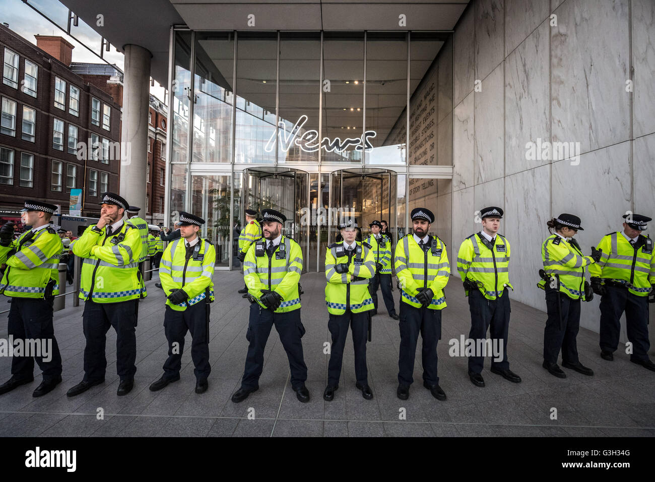 London, UK. 24th June, 2016. Police form a line outside the offices of Rupert Murdoch’s News International in London Bridge during a post EU referendum protest led by a few hundred pro-refugee protesters and anti-government anarchist groups marched from Aldgate in east London to News UK HQ in London Bridge Credit:  Guy Corbishley/Alamy Live News Stock Photo