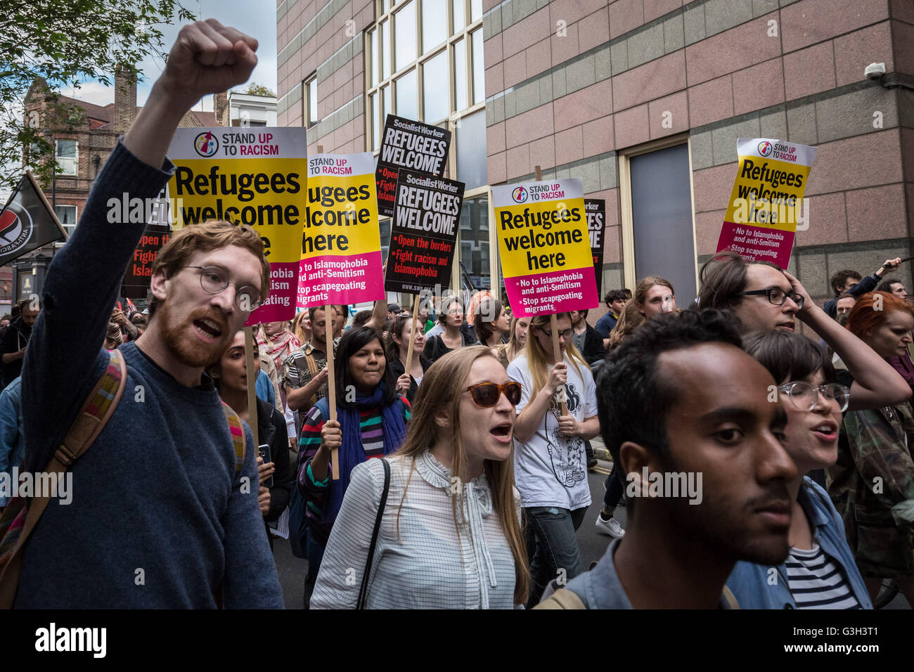 London, UK. 24th June, 2016. 'Refugees Welcome Here' placards. Defend All Migrants. A post EU referendum protest led by over five hundred pro-refugee protesters and anti-government anarchist groups marched from Aldgate in east London to News UK HQ in London Bridge Credit:  Guy Corbishley/Alamy Live News Stock Photo