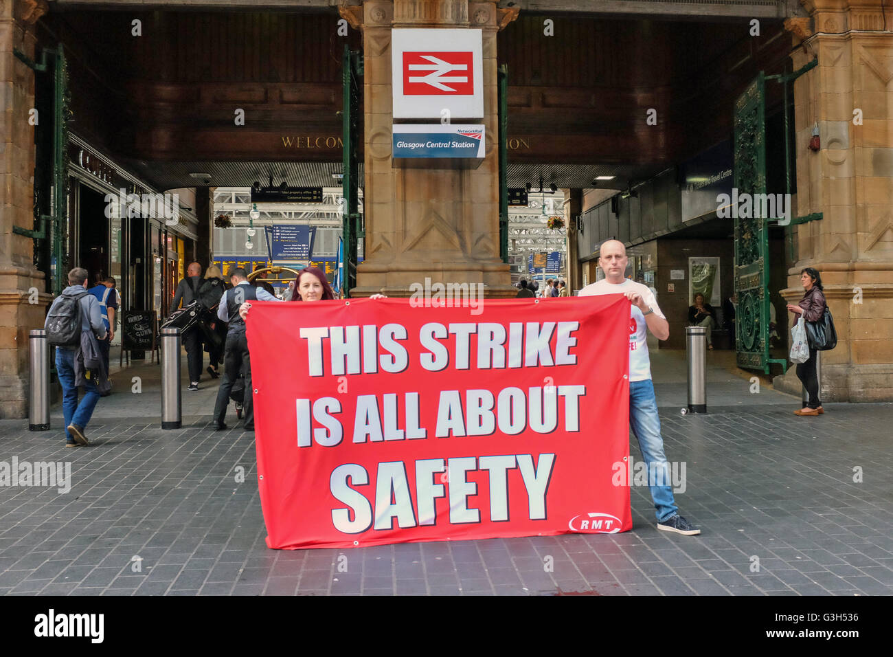 Glasgow Central Station, Scotland, UK. 25th June, 2016. An official picket of RMT union members formed a picket at Glasgow Central Railway Station in support of their dispute with their employers ABELLIO SCOTRAIL about the decision to get rid of guards on trains and are speaking to members of the public to gain support. This is the third one day strike and the Union members are arguing that by not having guards on the trains, this cost cutting measure is putting the travelling public in danger. Credit:  Findlay/Alamy Live News Stock Photo