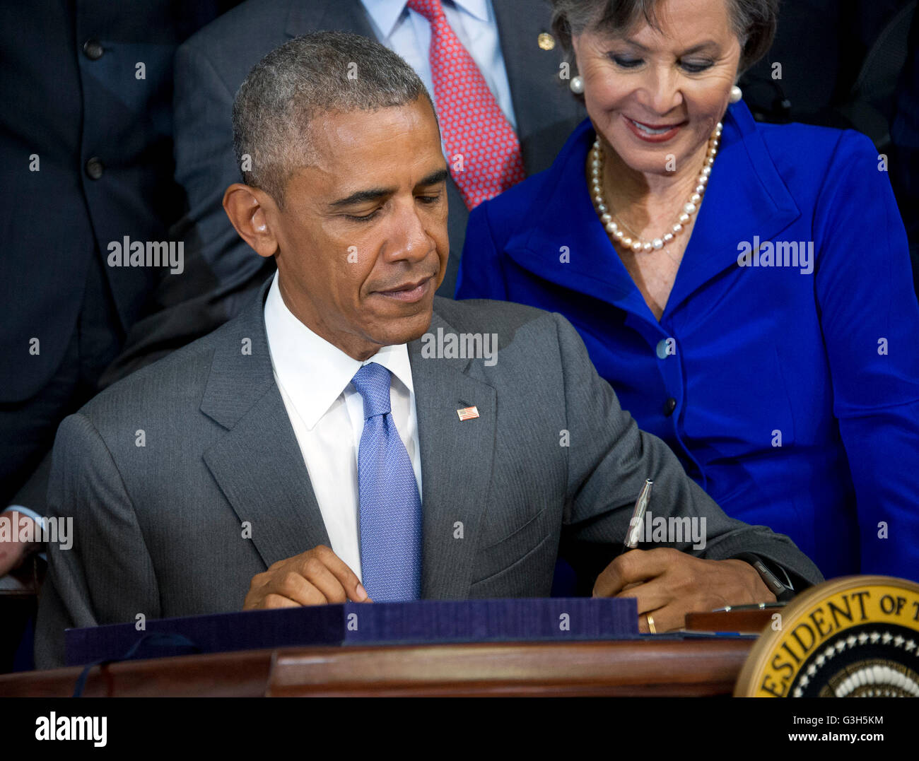 Certain Toxic Chemicals Used Regularly. 22nd June, 2016. United States President Barack Obama signs H.R. 2576, the Frank R. Lautenberg Chemical Safety for the 21st Century Act in the South Court Auditorium of the White House in Washington, DC on Wednesday, June 22, 2016. The bill will establish standards for the use of certain toxic chemicals used regularly. US Senator Barbara Boxer (Democrat of California) looks on from the right. Credit: Ron Sachs/CNP - NO WIRE SERVICE - © dpa/Alamy Live News Stock Photo