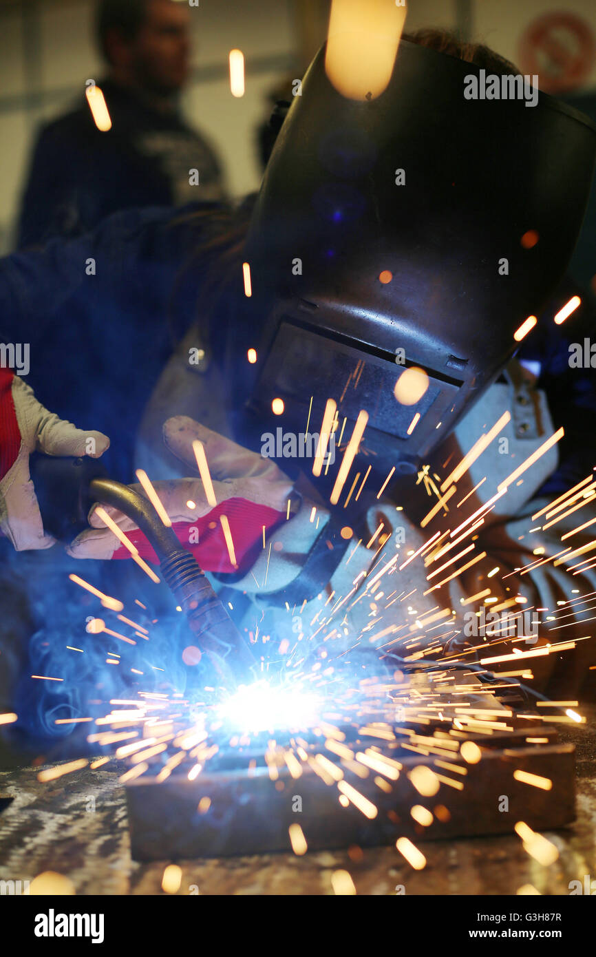 Cologne, Germany. 21st June, 2016. Welder trainees work on a piece of metal at the training centre Butzweilerhof in Cologne, Germany, 21 June 2016. Photo: Oliver Berg/dpa/Alamy Live News Stock Photo