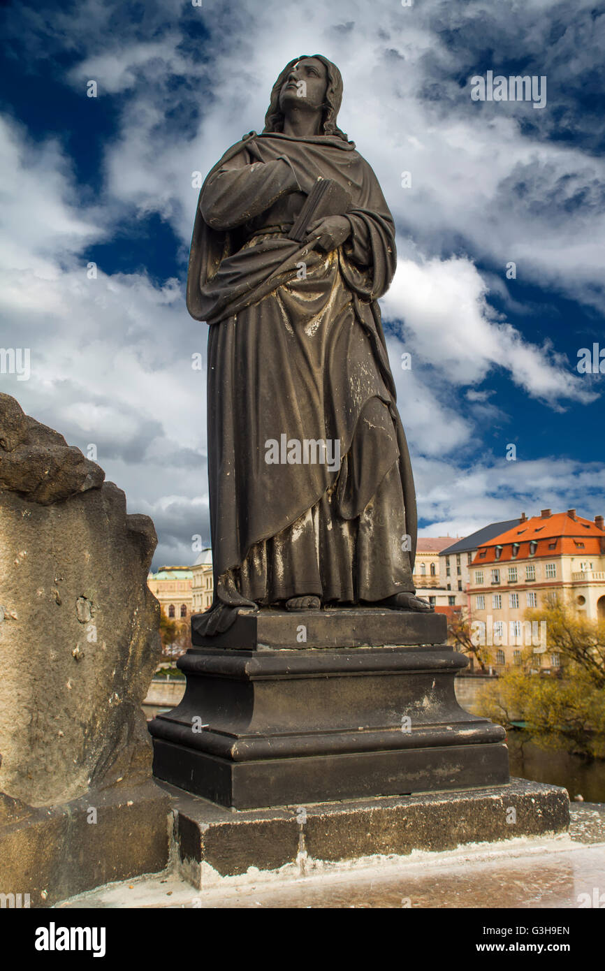Statue of Jesus Christ on the Cross on Charles Bridge in Prague, Czech Republic Stock Photo