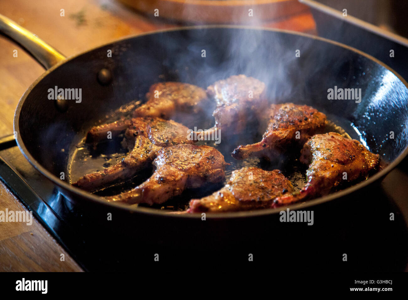 Lamb ribs in a frying pan Stock Photo