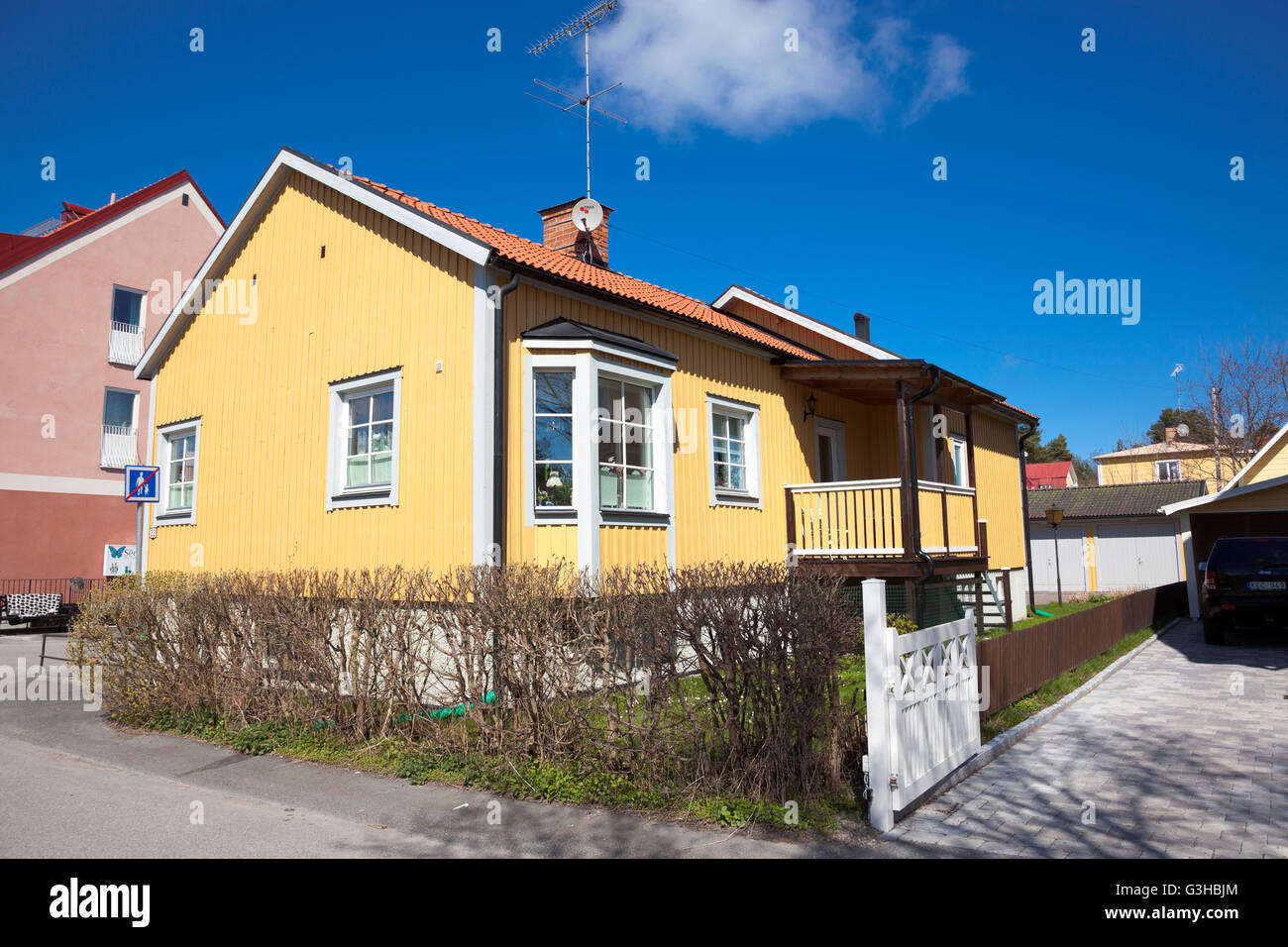 One storey family house painted yellow in Trosa, Sweden Stock Photo