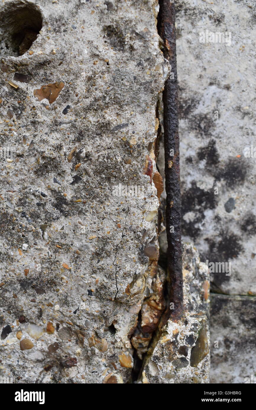 Rusty metal rod in worn away concrete Stock Photo - Alamy
