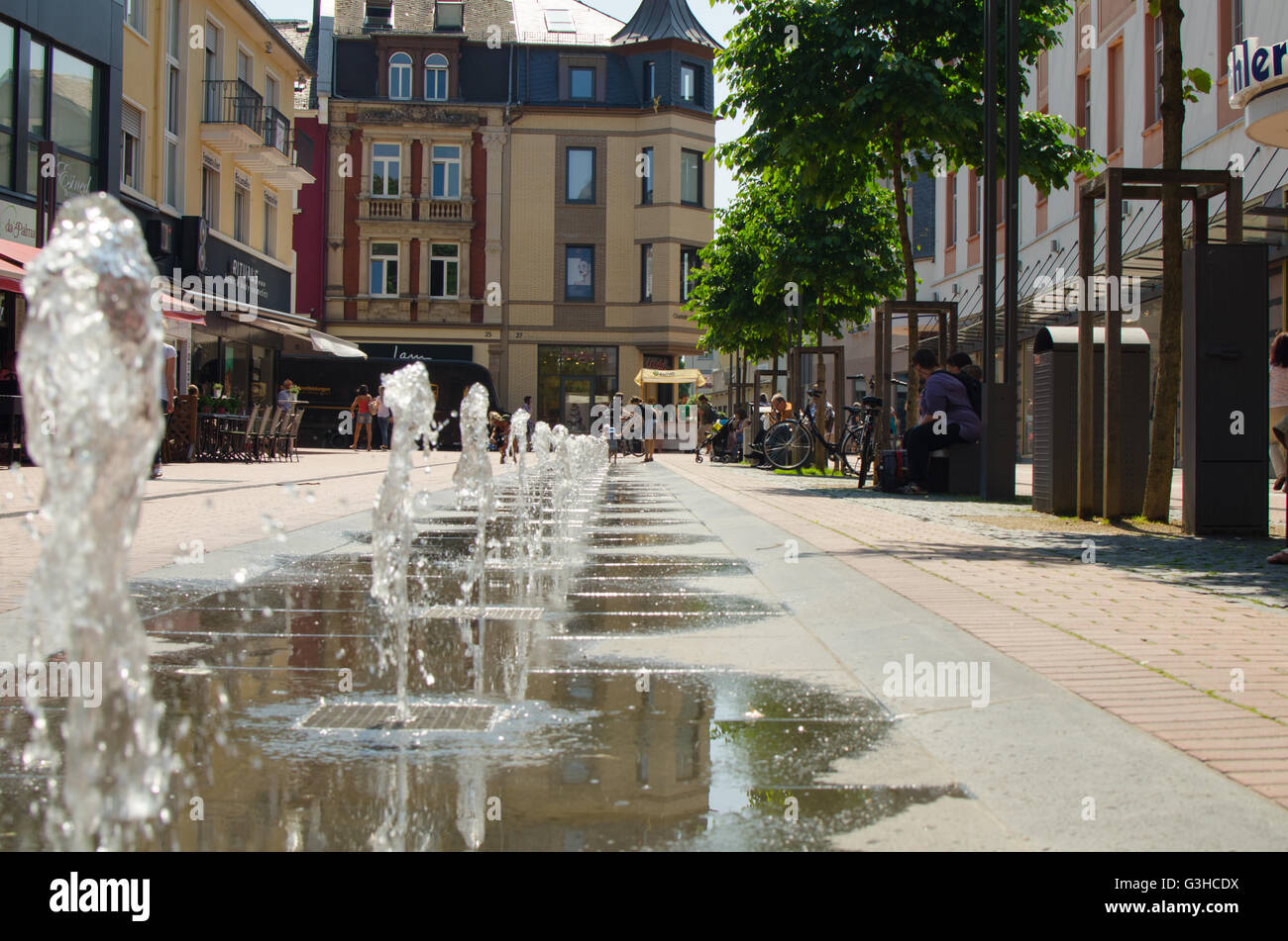 Water fountains in the pedestrian shopping zone in Gießen, Germany Stock Photo