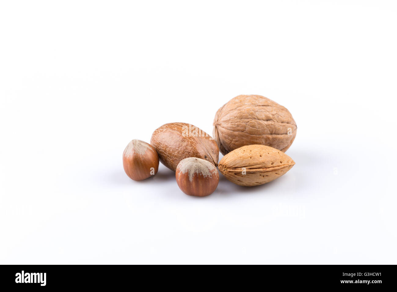 Variety of Mixed Nuts Isolated on White Background Stock Photo