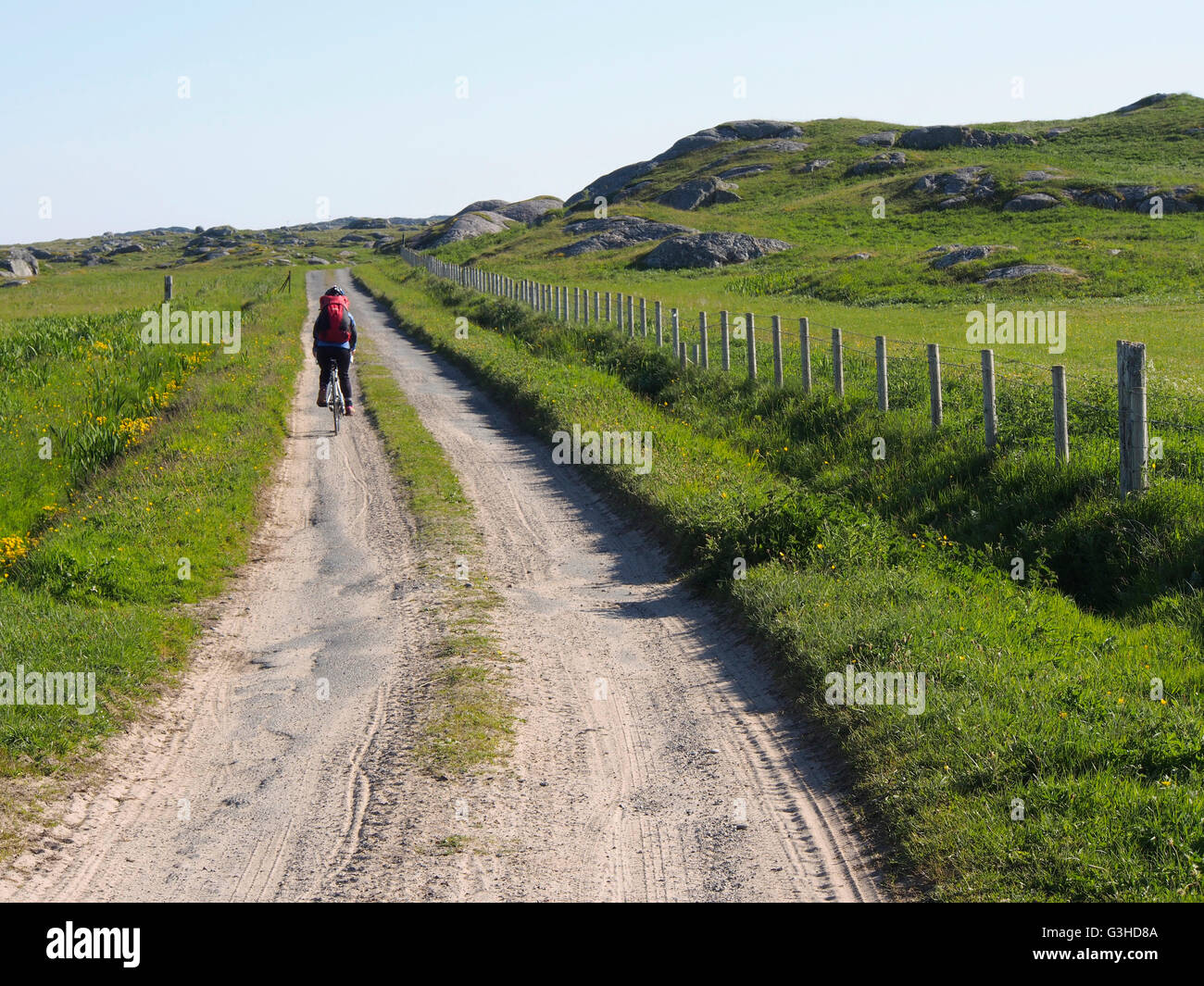 cycling on sandy track, Isle of Coll, Scotland Stock Photo